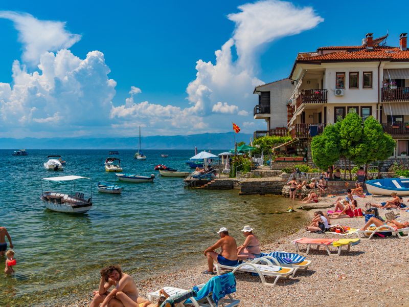 People enjoying the summer at the beach at Lake Ohrid in North Macedonia