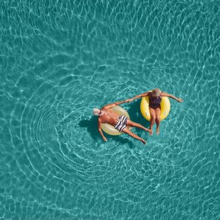 Senior couple enjoy sea water