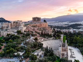 Aerial view of the Acropolis and Athens at sunset with the ancient citadel overlooking the city