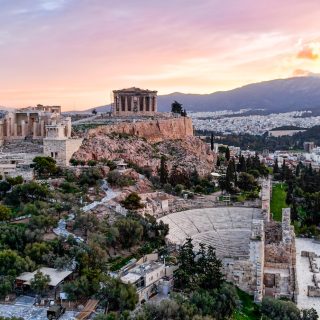 Aerial view of the Acropolis and Athens at sunset with the ancient citadel overlooking the city