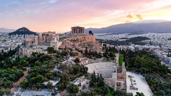 Aerial view of the Acropolis and Athens at sunset with the ancient citadel overlooking the city