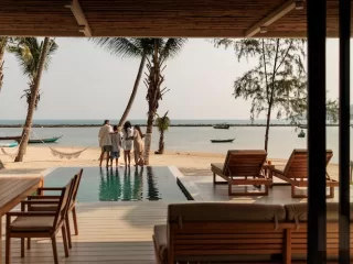 Luxury beachfront villa with a private pool and ocean view, representing residency by investment and lifestyle migration.