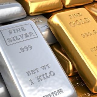 Silver and gold bullion bars displayed together as precious metals for inflation protection