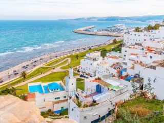 Coastal city view in Morocco with white buildings and oceanfront road
