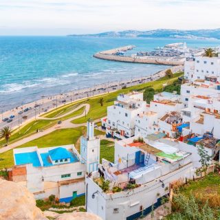 Coastal city view in Morocco with white buildings and oceanfront road