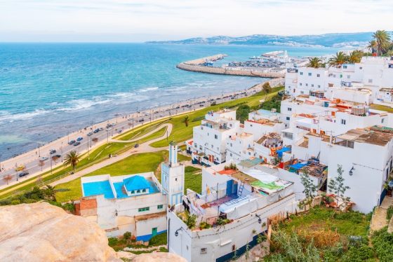 Coastal city view in Morocco with white buildings and oceanfront road