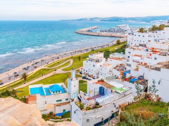 Coastal city view in Morocco with white buildings and oceanfront road