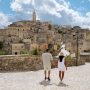 Couple walking through the historic streets of Matera, Italy