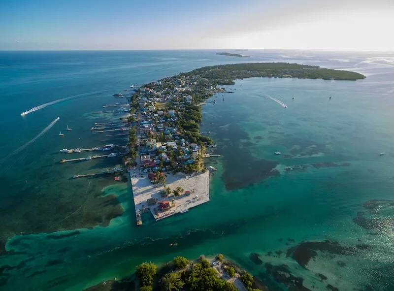 Aerial view of Belize island community surrounded by turquoise Caribbean waters