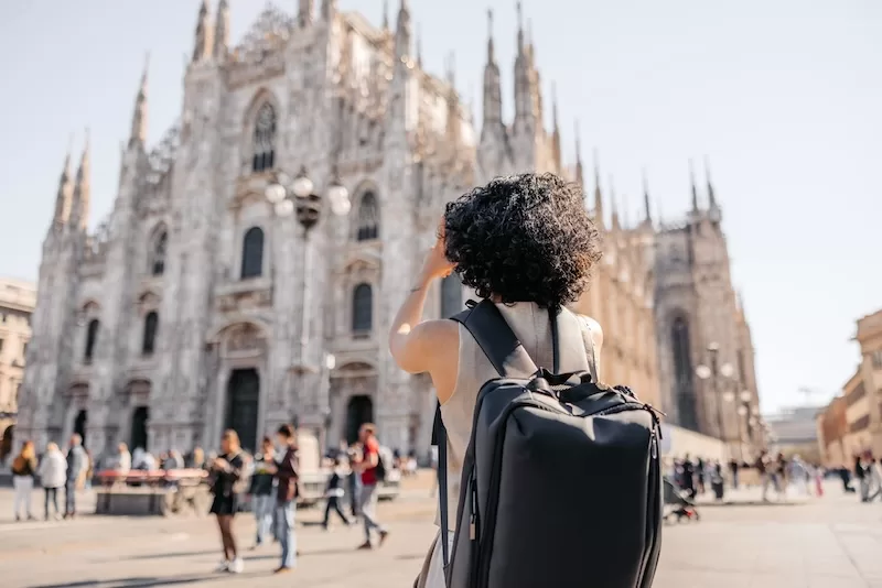Traveler photographing Milan Cathedral during a European trip