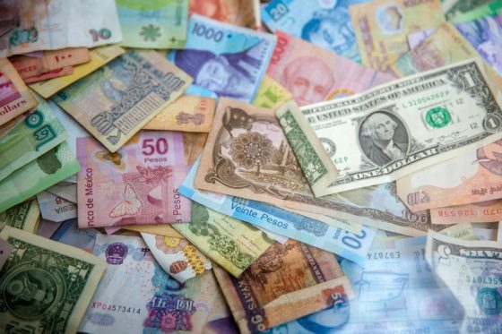 International banknotes showing currency exposure when buying property abroad