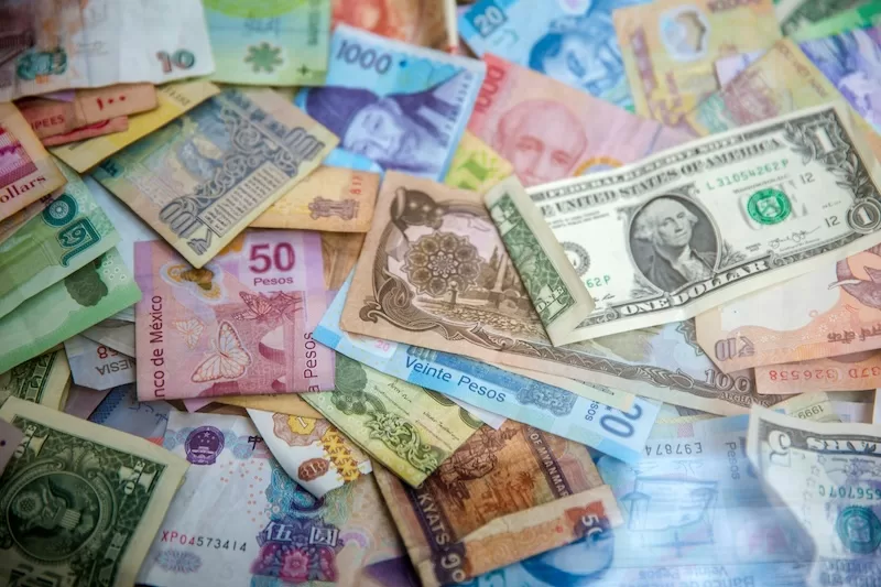 International banknotes showing currency exposure when buying property abroad
