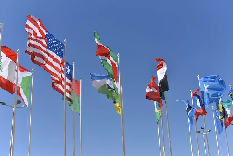 International flags representing banking across multiple jurisdictions