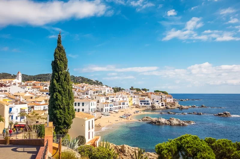 Whitewashed coastal town and beach on the Costa Brava