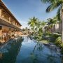 Liyongo resort rendering showing lagoon-style pools, stone walls, palm trees, and shaded villa terraces
