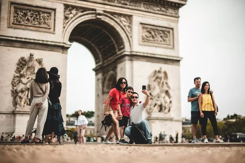 Families visiting the Arc de Triomphe in Paris, France