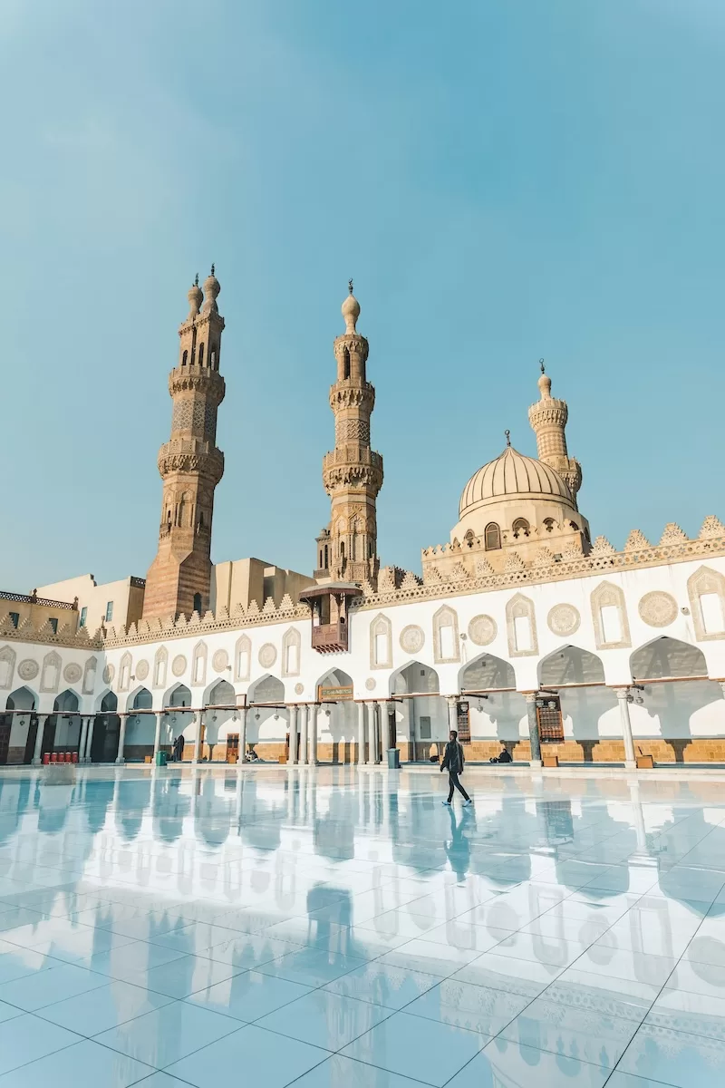 Historic mosque courtyard with ornate minarets in Cairo, Egypt