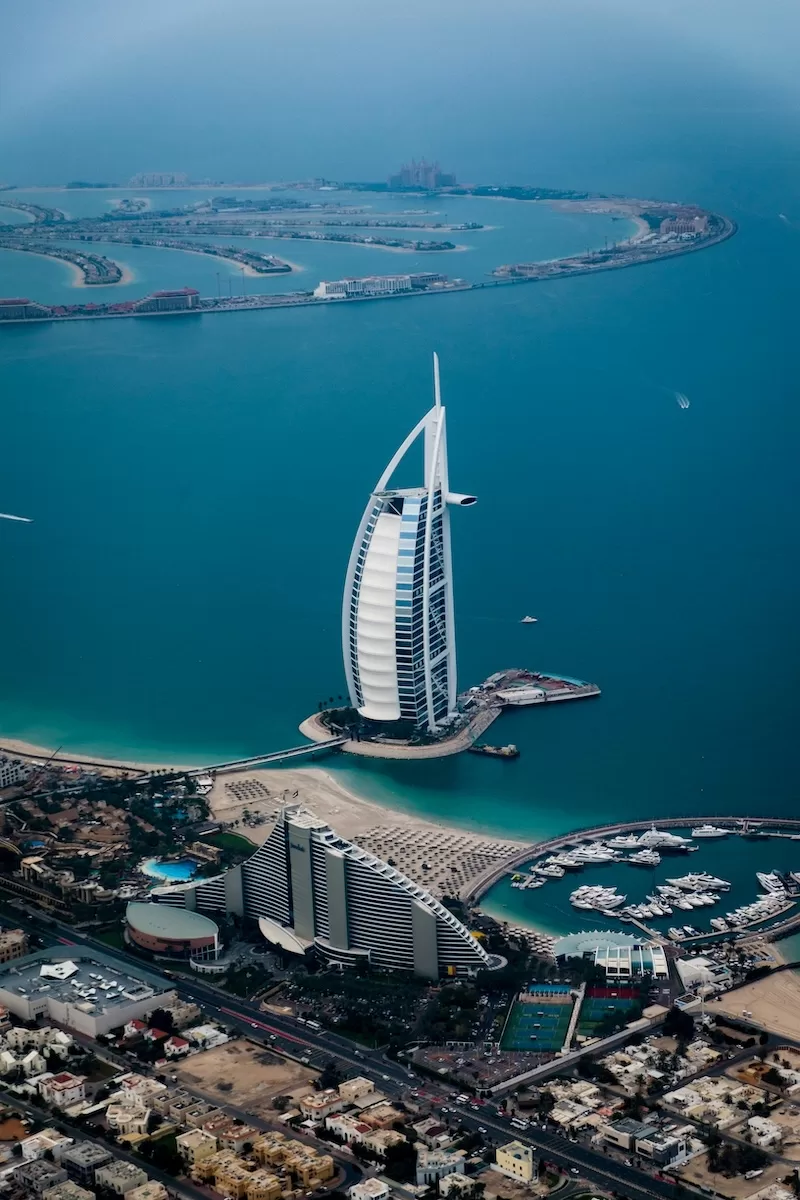 Aerial view of the Burj Al Arab hotel and Dubai's Palm Jumeirah coastline