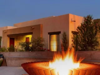 Casita and lit fire pit at dusk at Canyon Ranch Tucson, venue for Presidents' Week 2026