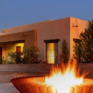 Casita and lit fire pit at dusk at Canyon Ranch Tucson, venue for Presidents' Week 2026