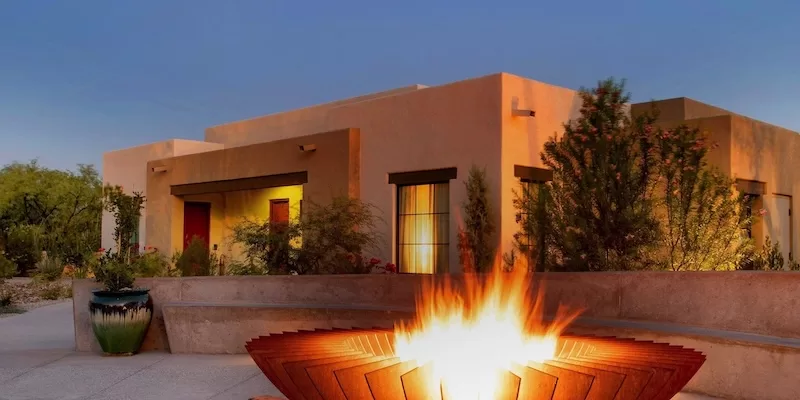 Casita and lit fire pit at dusk at Canyon Ranch Tucson, venue for Presidents' Week 2026