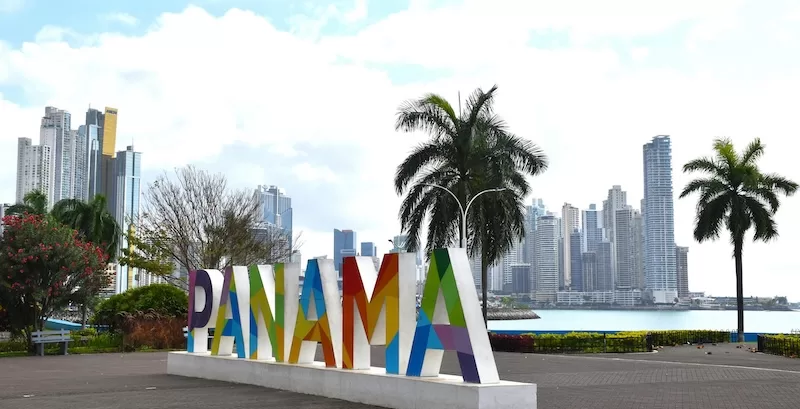 The Panama sign on the Panama City waterfront, backed by the financial district skyline