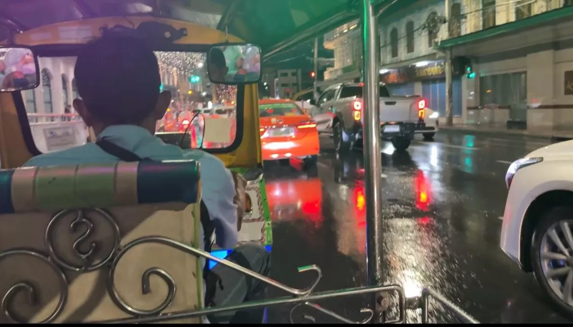Riding through wet Bangkok streets at night from the back seat of a tuk tuk, the moment a Bangkok tuk tuk scam story usually begins.