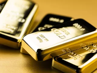 Stacked one kilogram fine gold bullion bars
