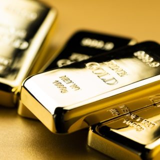 Stacked one kilogram fine gold bullion bars