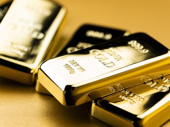 Stacked one kilogram fine gold bullion bars