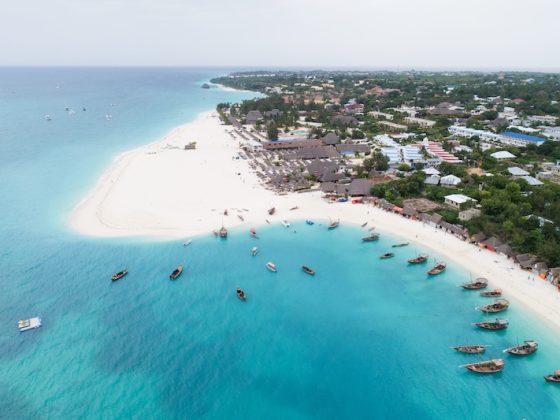 Aerial view of Kendwa beach on Zanzibar’s northwest coast, with dhow boats moored in shallow turquoise water