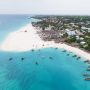 Aerial view of Kendwa beach on Zanzibar’s northwest coast, with dhow boats moored in shallow turquoise water