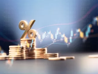 Stacks of gold coins under a percent sign against a rising market chart: the financial footing banking diversification protects