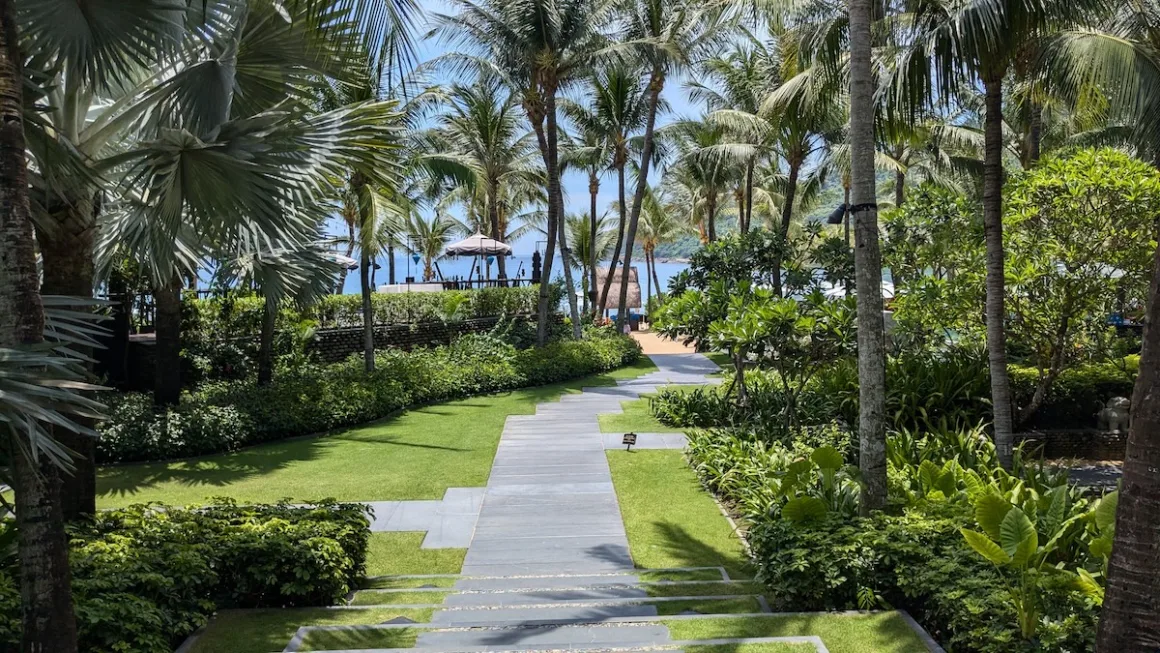 A stone path leads through palm gardens to the sea at a resort on Da Nang’s coast.