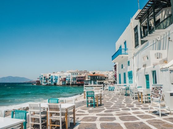Waterfront cafe tables in Little Venice, Mykonos, Greece, a reminder that expat rule changes 2027 brings are not all bad news.